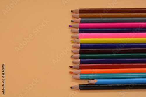 short dove pencil in a crowd of multi-colored pencils. Minimal creative concept. Leadership, independence, think differently, business success concept