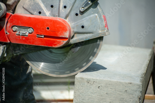 Fragment of a joint cutter on a brushed concrete surface.