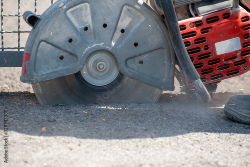 Fragment of a joint cutter on a brushed concrete surface.