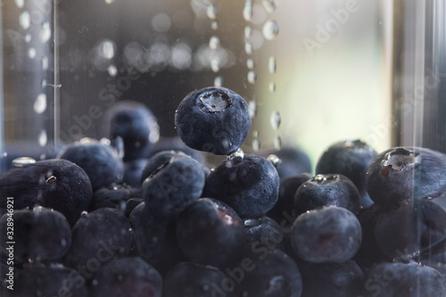 Blueberries floating in water photo