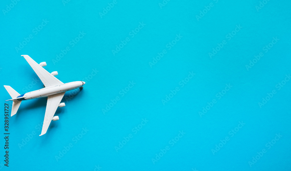 Plane on a pastel blue background with top view and copy space. Travel concept background Flat lay. Plane on a pastel blue background with top view and copy space. Travel concept background Flat lay.