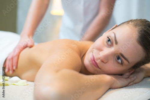 smiling woman having a back massage