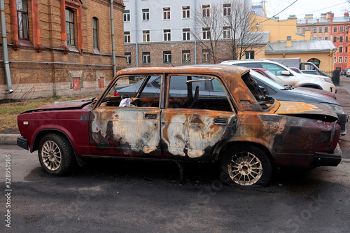 old car after a fire parked in a parking lot © Sergey