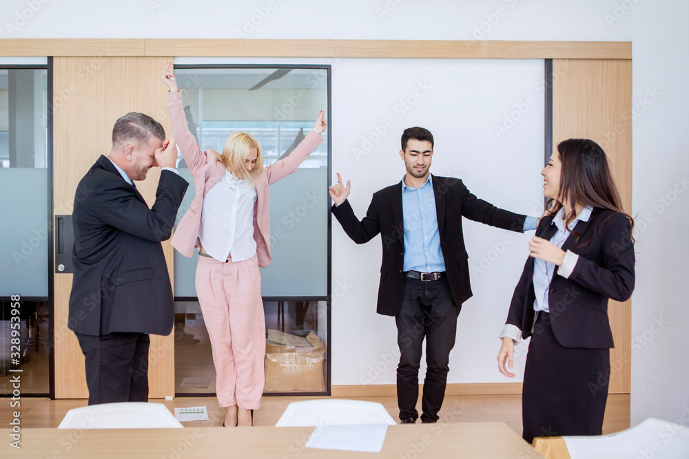 Diverse businesspeople dancing salsa happily Diverse businesspeople dancing salsa happily