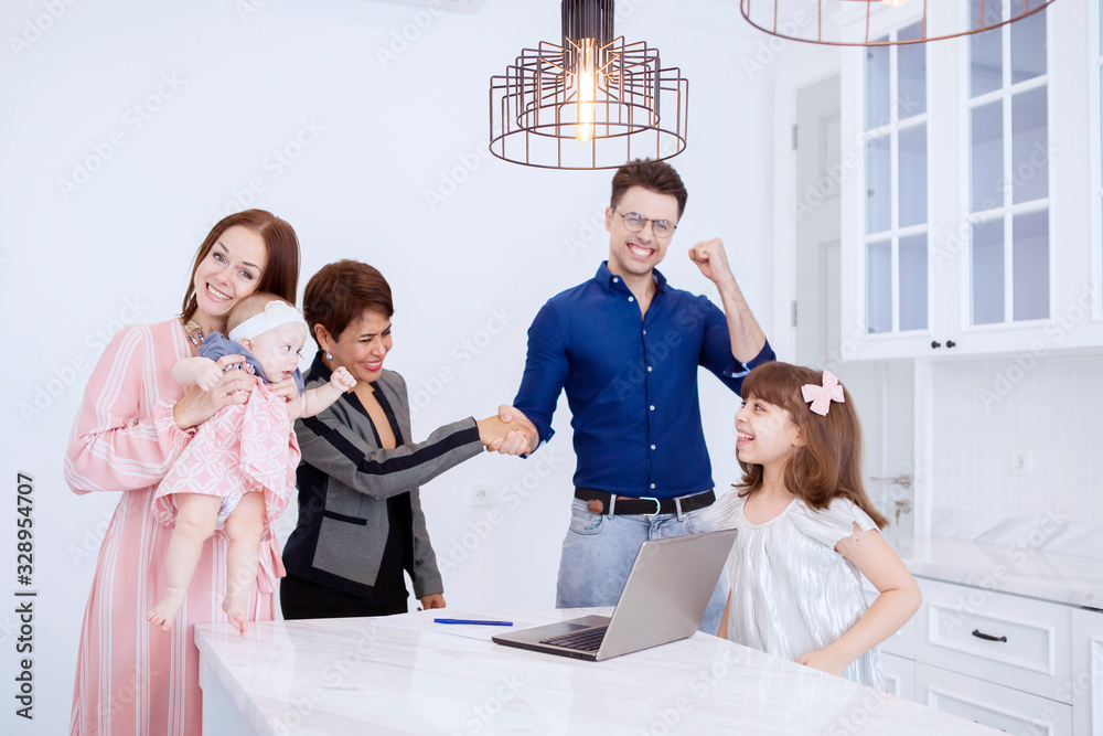 Fototapeta premium Joyful family and the Asian senior businesswoman