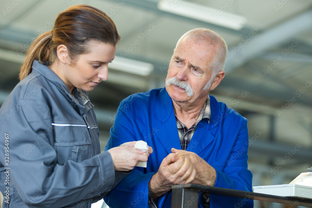 Fototapeta premium teacher tending to the apprentice cut