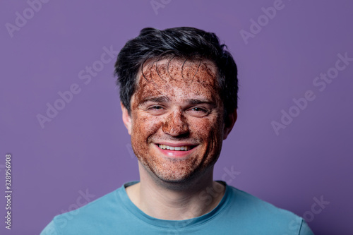 smiling guy in a face care mask