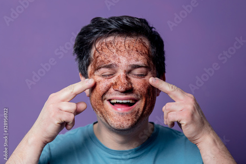 smiling guy in a face care mask