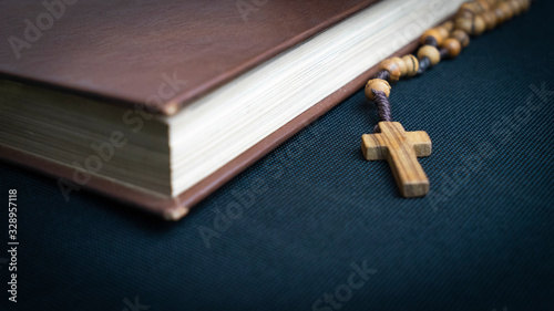 Fotografie, Obraz Closeup of the holy book bible and cross