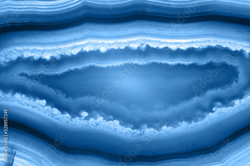 Abstract background - striped agate slice mineral, color of the year 2020 pantone classic blue 19-4052 © lukszczepanski