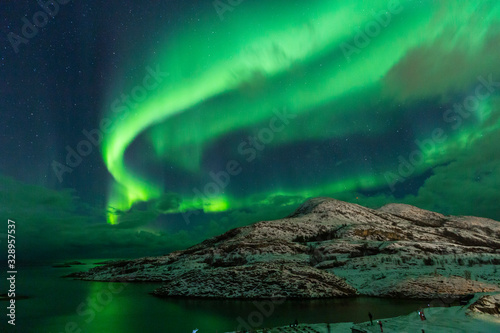 Northern lights on the arctic sky. Hillesoya, Sommaroya.