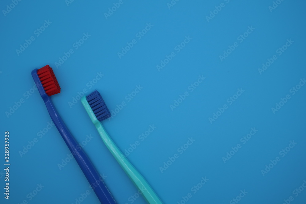 Tooth brushes on blue background Tooth brushes on blue background