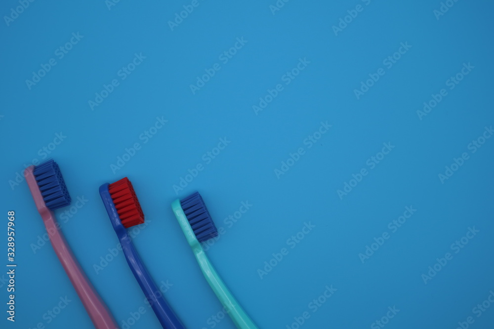 Tooth brushes on blue background Tooth brushes on blue background