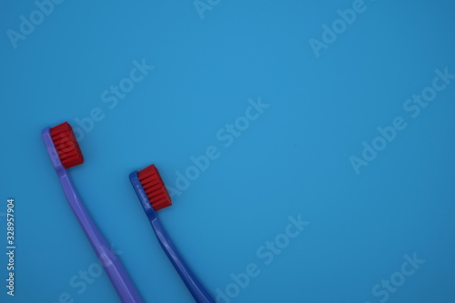Tooth brushes on blue background