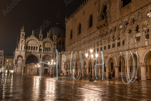 Writing with Light in front of the Illuminated Doge Palace on the Marks Square at Night, Venice/Italy photo