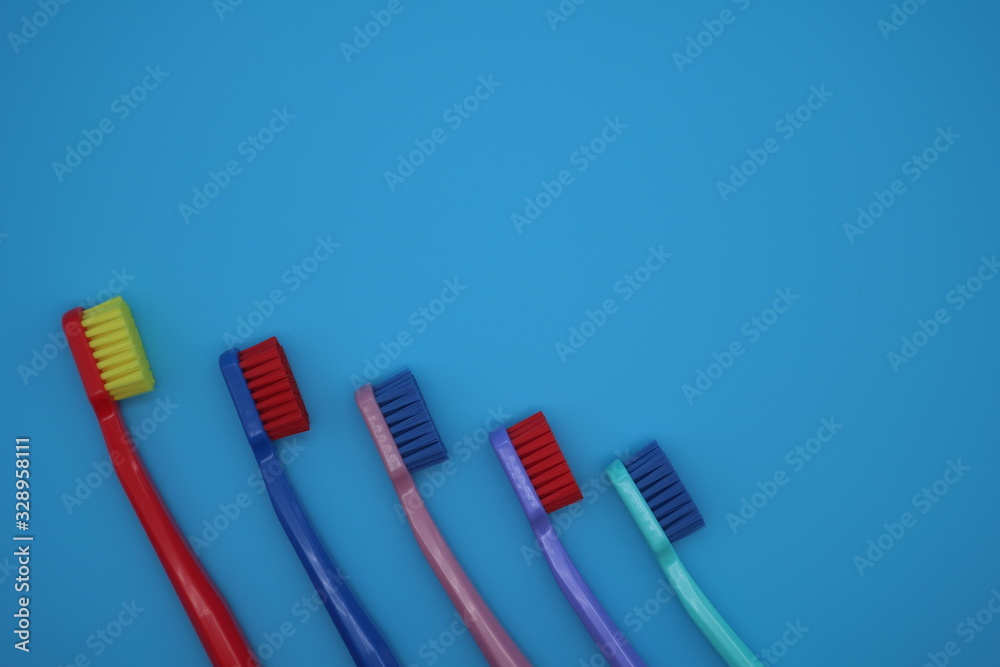 Tooth brushes on blue background Tooth brushes on blue background