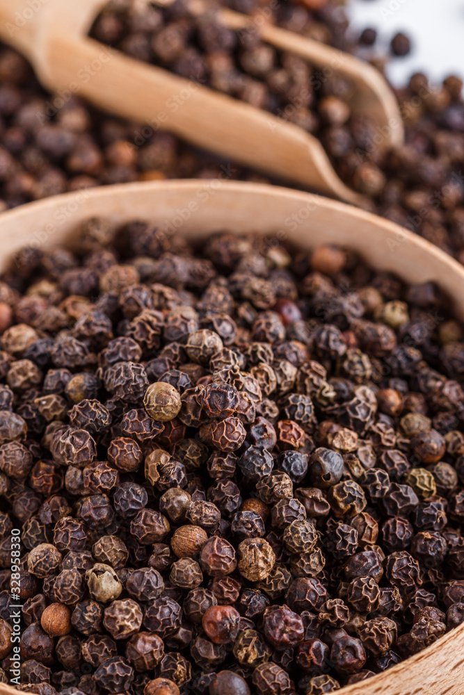 fragrant black pepper on white acrylic background fragrant black pepper on white acrylic background