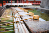 Purification fountain of water with stone and bamboo at shinto shrine, Japan
