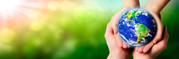 Caring Hands Of Man And Woman Holding Earth - Earth Day / Care For The Environment Concept - Some Elements Of This Image Were Provided By NASA