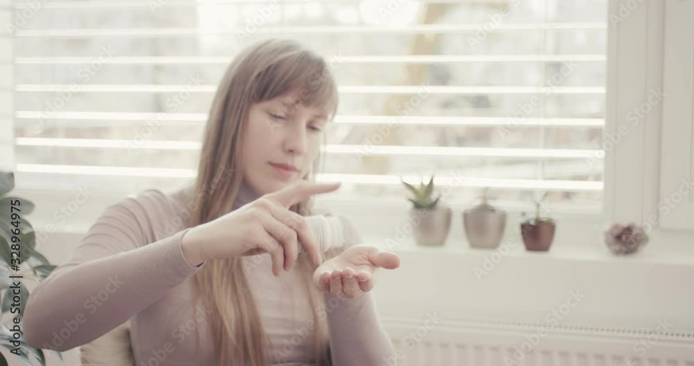 Woman takes pills virus coronavirus at home quarantine close up Woman takes pills virus coronavirus at home quarantine close up