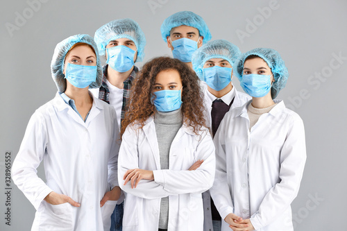 Group of doctors with prote...