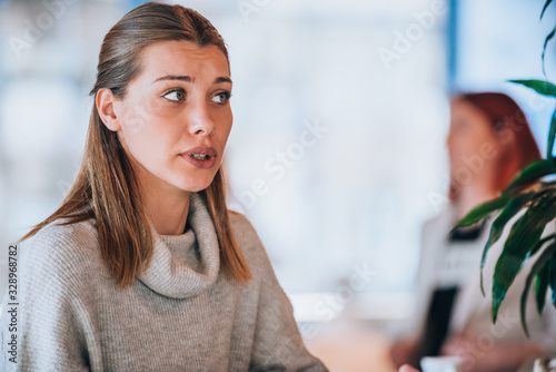 Portrait of girl sitting in coffee shop