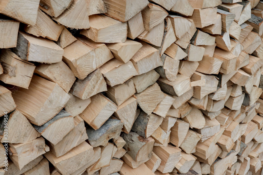 Stacks of Firewood. Preparation of firewood for the winter. Pile of Firewood.Firewood background Stacks of Firewood. Preparation of firewood for the winter. Pile of Firewood.Firewood background