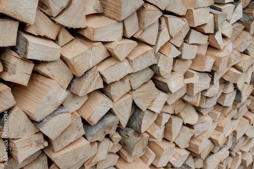 Stacks of Firewood. Preparation of firewood for the winter. Pile of Firewood.Firewood background