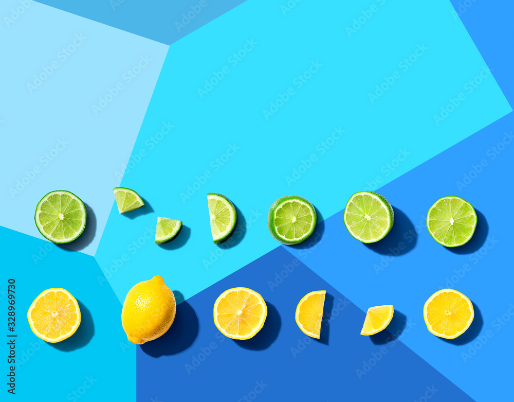 Fresh lemons and limes overhead view - flat lay Fresh lemons and limes overhead view - flat lay