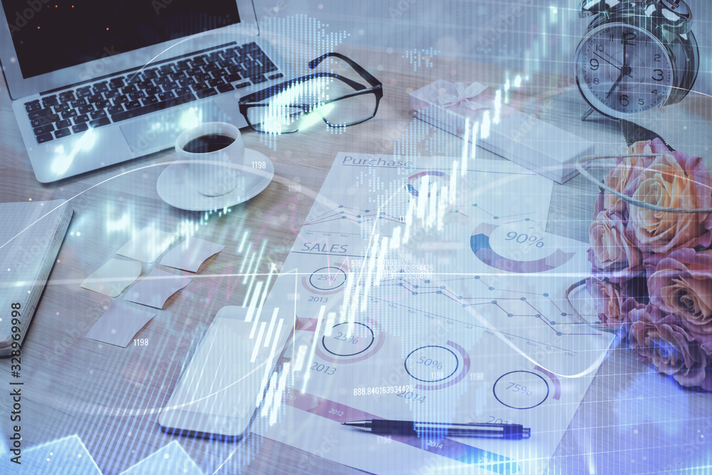 Forex market chart hologram and personal computer background. Multi exposure. Concept of investment. Forex market chart hologram and personal computer background. Multi exposure. Concept of investment.
