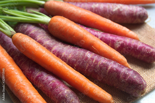 Close-up of some purple and orange carrots