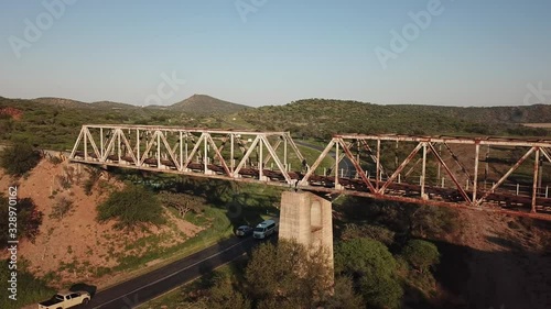 4K aerial drone video view of historical railway bridge on main B6 road from Windhoek to Gobabis and Windhoek Hosea Kutako Airport in central highland Khomas Hochland of Namibia, southern Afric photo