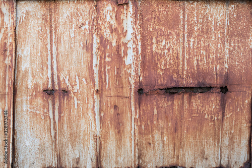 Old rusty metal sheet. The rusty metal background.