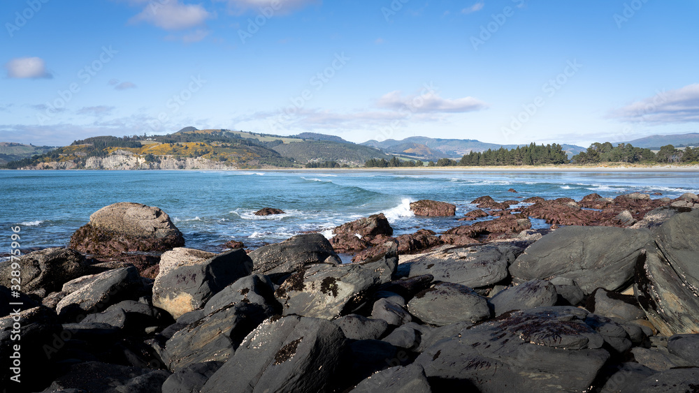 coastal landscape in New Zealand. Beach at high tide
