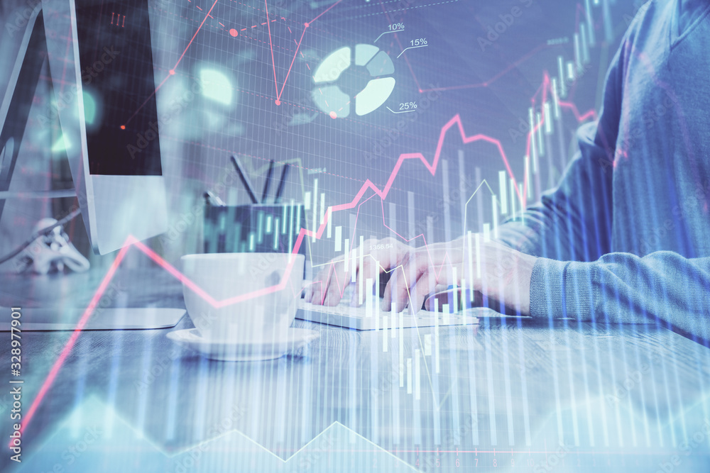 Multi exposure of graph with man typing on computer in office on background. Concept of hard work. Multi exposure of graph with man typing on computer in office on background. Concept of hard work.