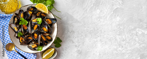 Delicious and healthy steamed mussels on white background