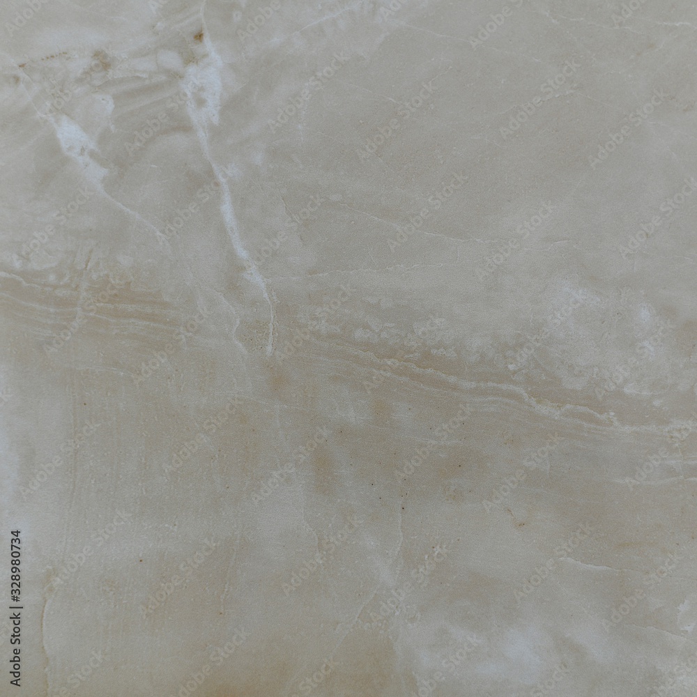 Naklejka premium Natural beige polished marble with a sloping line dividing the frame in half and two white zippers from the top corner.