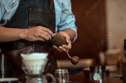 the barista setting the coffee grinder