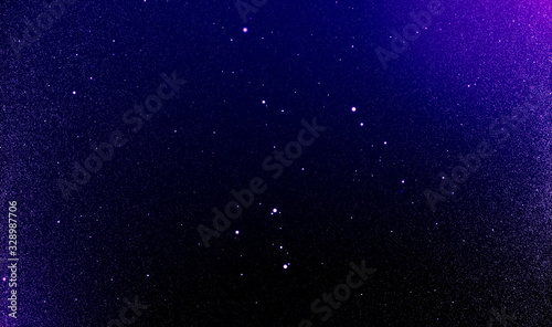 Obraz na płótnie Abstract dust particles stars in the night sky background of flickering Ultra Violet tone and light flare w salonie