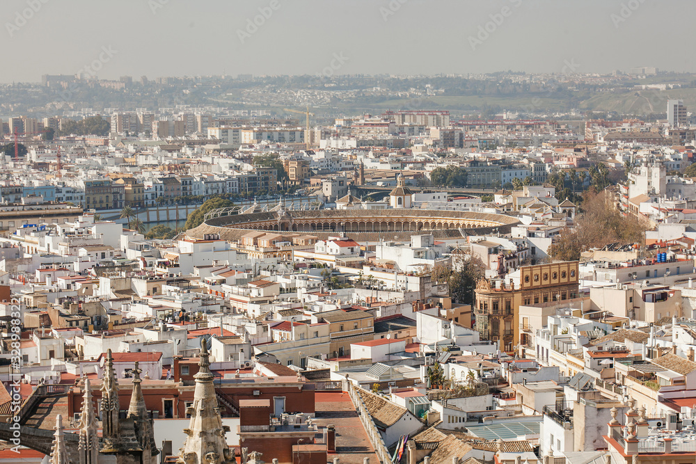 Panorama cityscape aerial view of Seville Spain. Arena of bullfighting in Seville