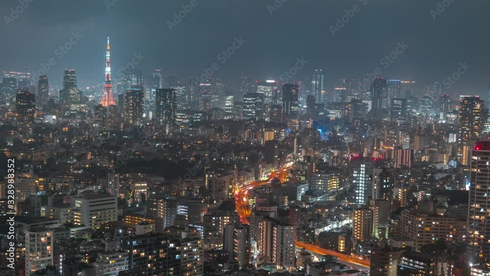 Night cityscape timelapse of Tokyo skyline. Wide shot, zoom in. Night cityscape timelapse of Tokyo skyline. Wide shot, zoom in.