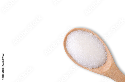 White sand sugar in wooden spoon isolated on white background with clipping path. Unhealthy diet ,awareness and stop diabetes concept.Top view. Flat lay. Space for text. photo