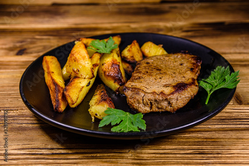 Roasted beefsteak with the fried potato and parsley