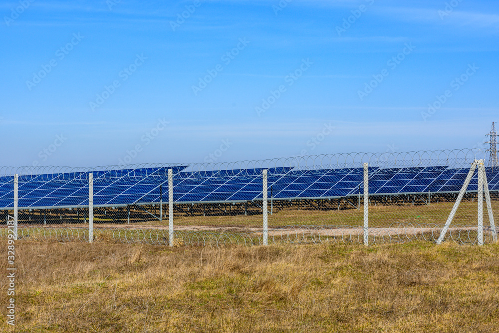 Many solar panels in a field. Clean energy. Ecological concept