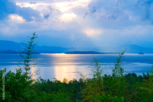 Sunrise in the morning after the rain on lagoon and mountain