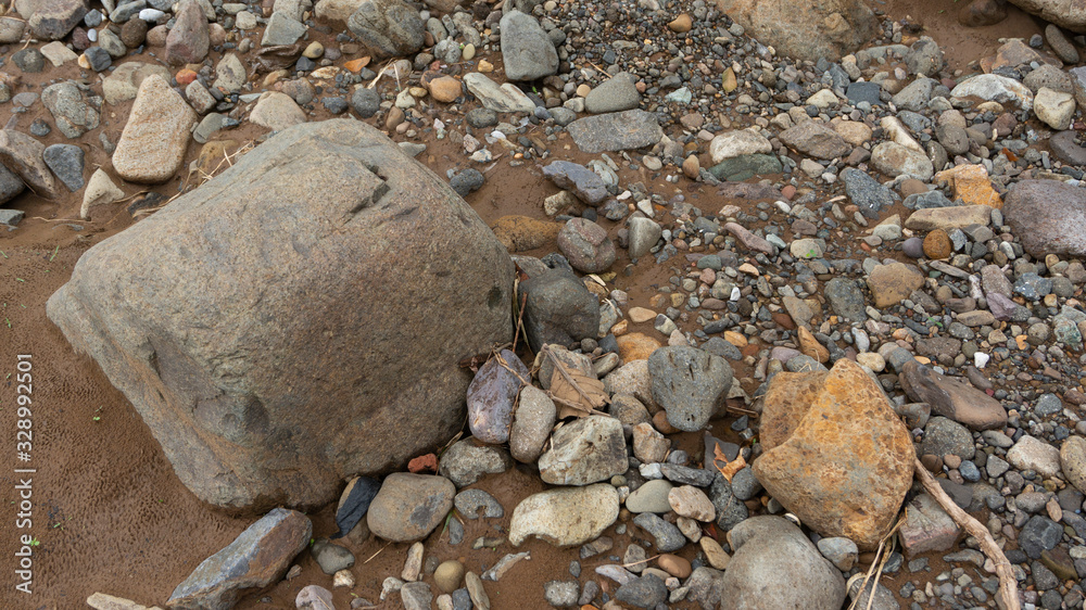 Rocks in the river after the flood. Images suitable for use as wallpaper or graphic material Rocks in the river after the flood. Images suitable for use as wallpaper or graphic material