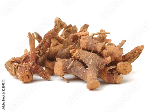 Dried galangal root isolated on white background