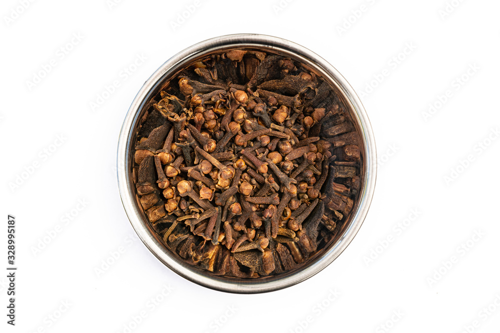 Cloves in Stainless Steel bowl isolated on a white background, aromatic cooking ingredient spice and condiment. Closeup detail, medicinal properties. Cloves in Stainless Steel bowl isolated on a white background, aromatic cooking ingredient spice and condiment. Closeup detail, medicinal properties.