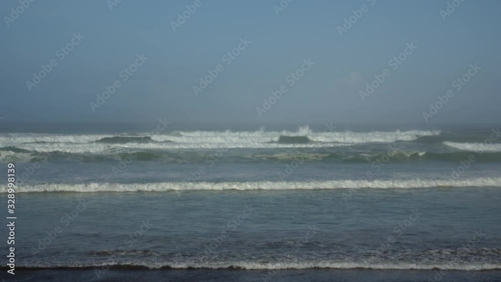 Small ocean waves breaking on beach at dawn early morning. Small ocean waves breaking on beach at dawn early morning.