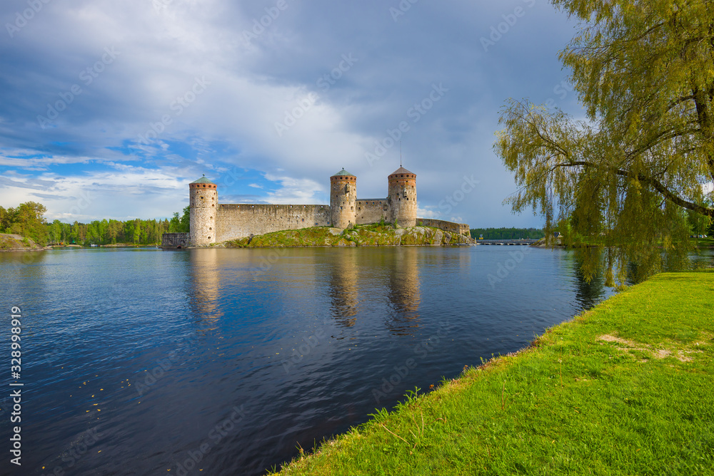 View of the old Olavinlinna fortress on a cloudy June day. Savonlinna, Finland